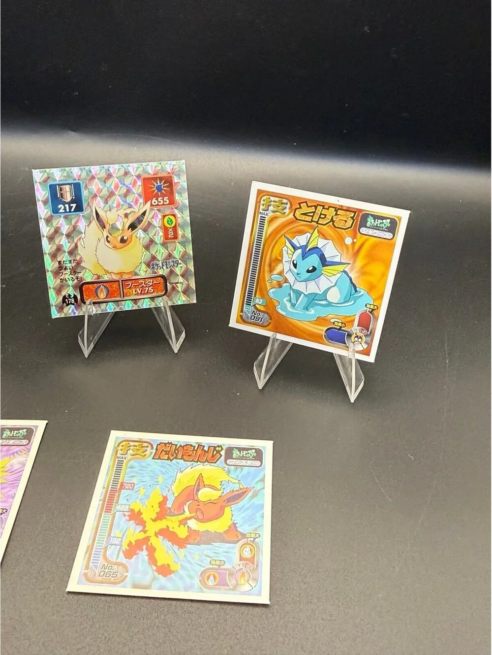 Vintage Japanese Pokémon Eeveelution sticker lot featuring Jolteon, Flareon, and
